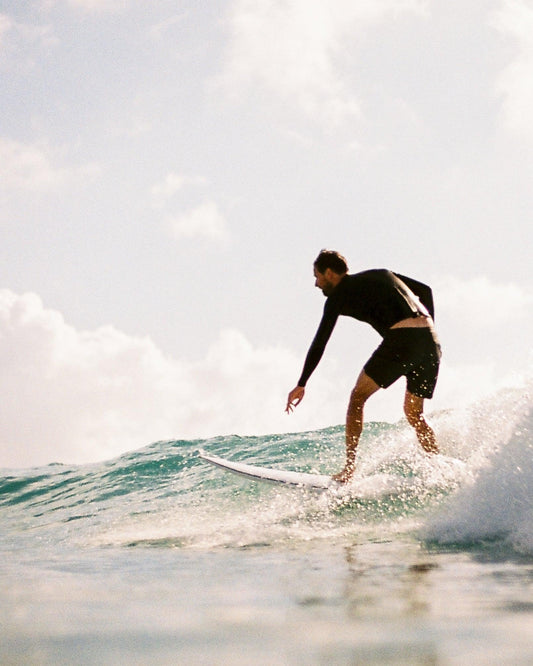 Girl riding white wash surfing