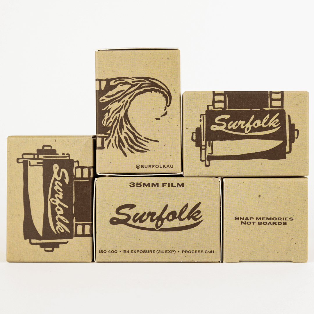 Five boxes of Surfolk 35mm film with branding and designs related to photography and vintage aesthetics.