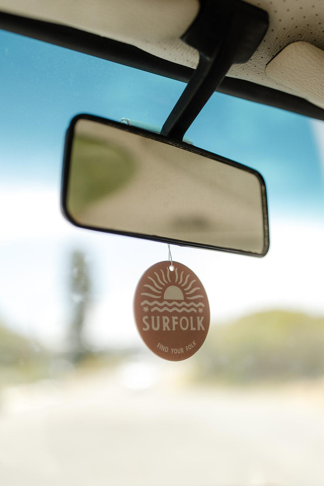 Coconut surf scented car air freshener for the van or 4WD to take on road trips hanging from rear vision mirror ready for road trips along the coast made from recyclable and sustainable materials find your folk.
